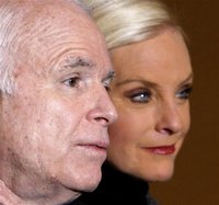 Republican presidential hopeful, Sen. John McCain, R-Ariz., accompanied by his wife Cindy, speaks at a news confernece in Toledo, Ohio. Thursday, Feb. 21, 2008. (AP Photo/Gerald Herbert)